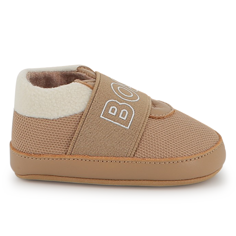 Zachte pantoffels van schapenvacht BOSS 
                        UNISEX