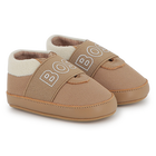 Zachte pantoffels van schapenvacht BOSS 
                    UNISEX